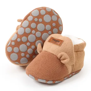 Detail view of warm plush-lined baby walking shoes featuring soft non-slip soles for winter