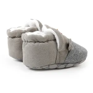 Side view of grey infant warm booties with soft fleece lining and grey knit toe section