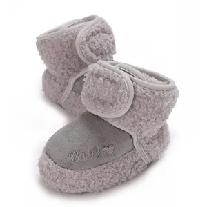Detailed view of grey baby winter snow boots featuring soft faux fur and heart embroidery