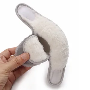Close-up detail of warm white faux fur lining in grey baby winter walking boots