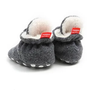 Rear view of warm plush baby booties with soft white faux fur lining and non-slip sole