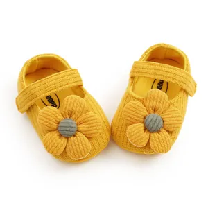 Yellow soft-soled knitted baby girl princess shoes with large flower decoration