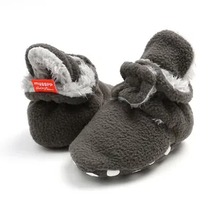Cozy dark grey fleece baby boots with soft soles for winter warmth and infant comfort