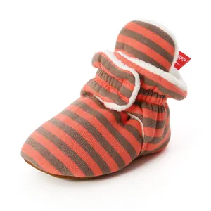 Detail view of baby striped walker sock shoe with soft fleece lining and warm cotton fabric