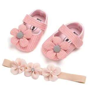 Soft pink knitted baby girl princess shoes and matching floral headband set for infants