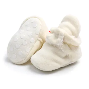 Close-up detail of warm soft fleece baby pre-walker boots with non-slip sole for toddlers
