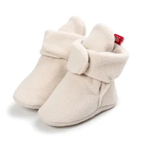 Soft cream fleece baby booties with adjustable hook and loop strap for walker infants