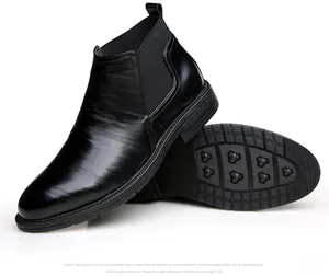 Black leather men's Chelsea boots featuring side profile and non-slip rubber sole detail