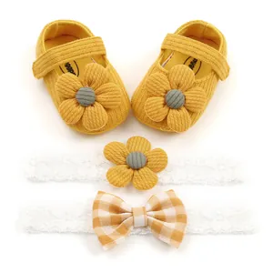 Detail set of yellow floral baby girl soft-sole shoes with matching lace headbands