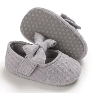 Close-up of purple baby princess shoes showing soft non-slip sole and elegant bow detail