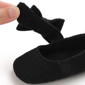 Close-up of black baby princess shoe with Velcro strap for toddlers