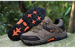 Detail view of men's brown outdoor hiking shoes with thick non-slip rubber soles