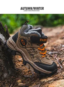Detailed side view of boys' outdoor winter snow boot featuring warm faux fur lining