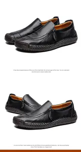 Detail handgefertigter schwarzer Leder-Loafer mit Reißverschluss und Nahtdetails