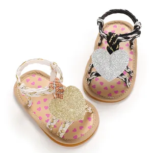 Detail view of baby girl summer sandals with glittery heart and soft rubber sole