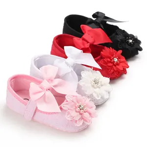 Detailed view of four colorful floral infant princess walking shoes for baby girls