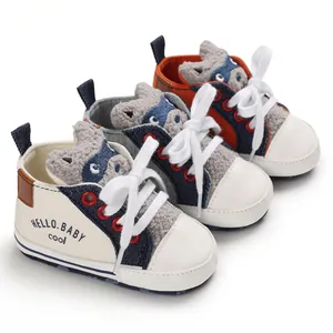 Detail view of cartoon baby walking shoes in three colors with soft soles and laces