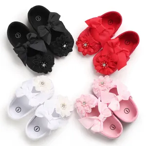 Collection of adorable baby princess walking shoes with ribbon bows and floral details