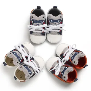 Three pairs of colorful cartoon raccoon baby walking shoes with soft soles and laces