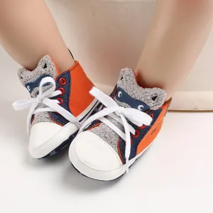 Close-up view of cute cartoon animal baby walking shoes with soft soles and white laces