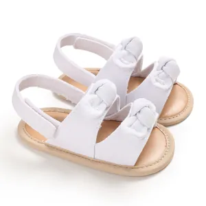 Sandales blanches de marche pour bébé avec semelles souples et nœuds pour l'été