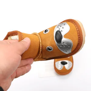 Close-up of flexible cartoon dog snow boot with warm plush lining