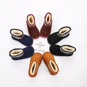 Detailed view of colorful children's snow boots with soft fur lining and artistic print