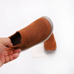 Detail view of brown breathable knit toddler sock shoes with flexible non-slip soft sole.