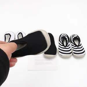 Close-up of breathable knit baby sock shoes with flexible soft rubber soles for toddlers