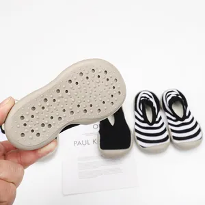Detail view showing the textured non-slip soft rubber sole of toddler sock walking shoes