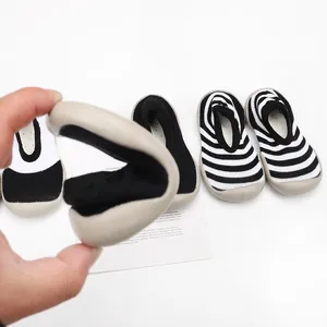 Detail showing the ultra-flexible soft sole of striped toddler walking sock shoes