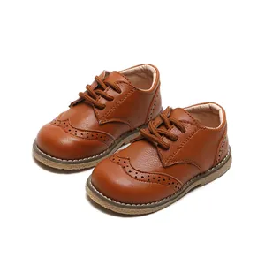 Classic brown toddler brogue dress shoes with comfortable lace-up design for boys.