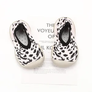 Baby indoor walking sock shoes with leopard print pattern and soft beige rubber sole