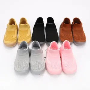 Breathable soft-sole children's sock shoes in vibrant colors for baby walkers.