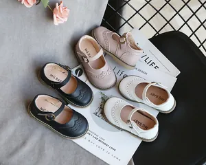 Detailed view of three colors of girls' soft leather Mary Jane shoes with brogue details