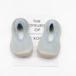 Top view of breathable blue children's sock shoes with soft rubber soles.