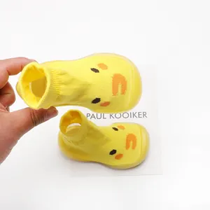 Yellow baby sock shoes with cute duck face pattern and soft breathable rubber sole