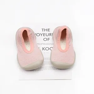 Detailed top view of pink breathable knit baby walker shoes featuring flexible rubber soles