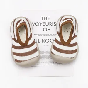 Close-up of brown and white striped toddler walking shoes with breathable soft soles
