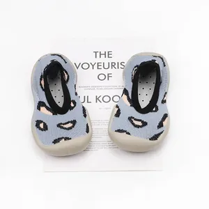 Leopard print knit baby walking shoes with flexible soft grey rubber soles for indoor use