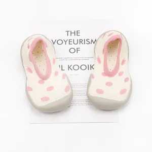 Comfortable soft sole baby sock shoes with pink polka dots for indoor floor walking