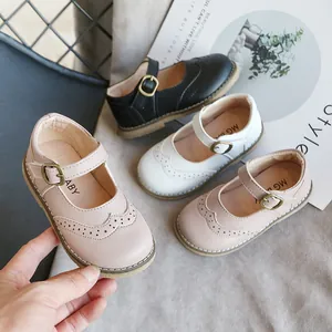 Japanese-style girls round-toe Mary Janes in soft leather with brogue details