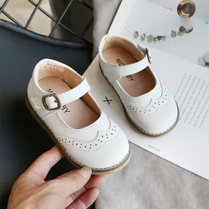 Classic white leather Mary Jane shoes for girls with elegant brogue detailing