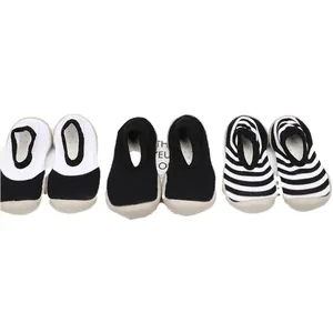 Breathable baby walking sock shoes with non-slip soft soles in black and white styles.
