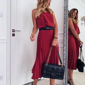 Elegant red sleeveless V-neck pleated midi dress for women in a stylish indoor setting