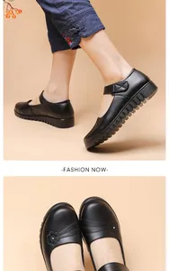 Close-up of black genuine leather non-slip flat shoes with elegant floral pattern for women