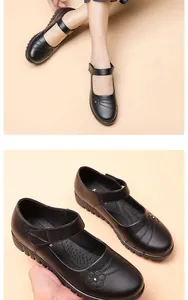Close-up of black genuine leather shoes for women with floral detail and velcro strap
