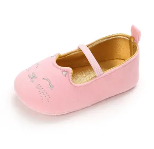 Soft pink baby walker shoes featuring an embroidered cat face and shiny gold lining