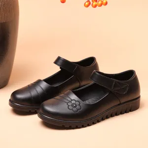 Classic black genuine leather Mary Jane flats for elderly women with elegant floral pattern