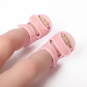Detailed view of pink breathable mesh baby sandals featuring adjustable velcro straps for infants.